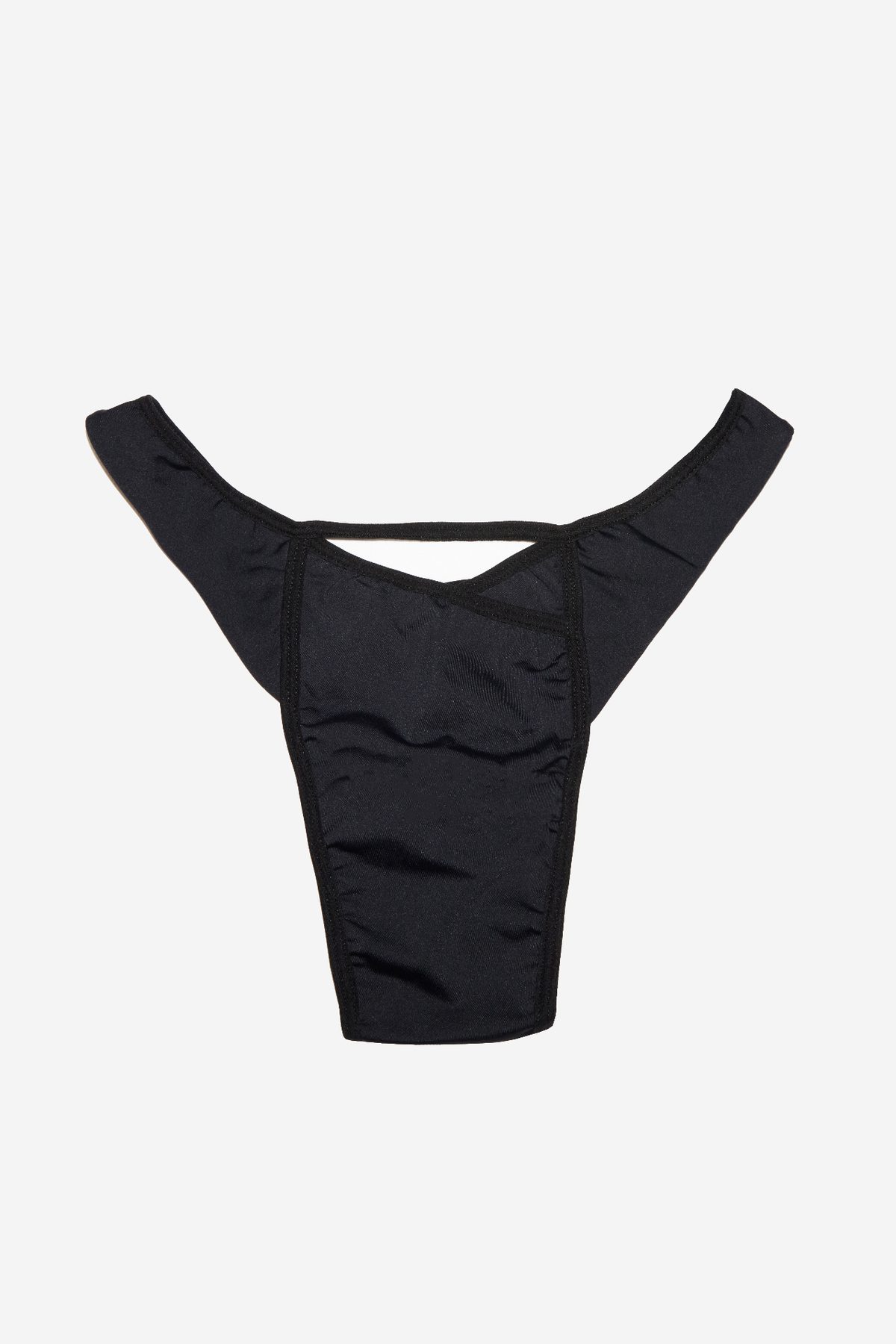 Vicky Baey Essential Tucking Thong flat lay in black