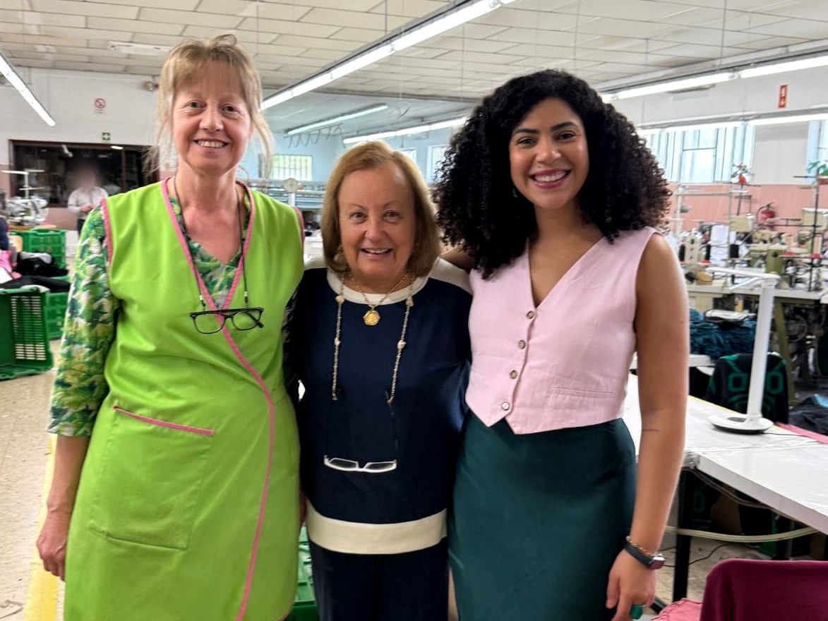 Three women standing together inside the family-run Portuguese lingerie atelier where the Vicky Baey Essential Tucking Thong is made.